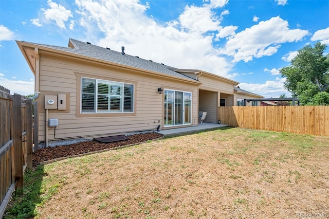 5795 Xenon Way, Arvada, CO 80002 - back of house featuring a fenced backyard and a patio area