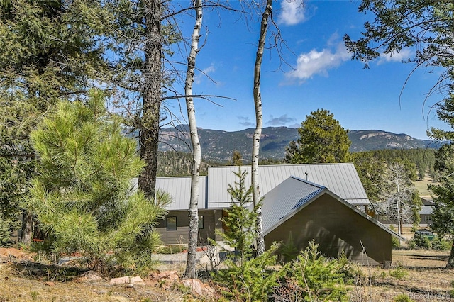 96 Garnet Ln, Pine, CO 80470 - view of home's exterior featuring a mountain view and a metal roof