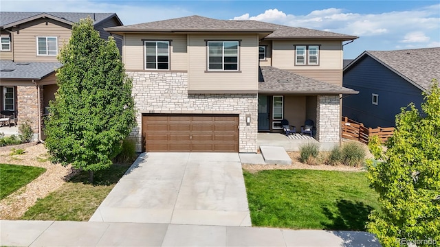 view of front facade featuring a garage and a front yard