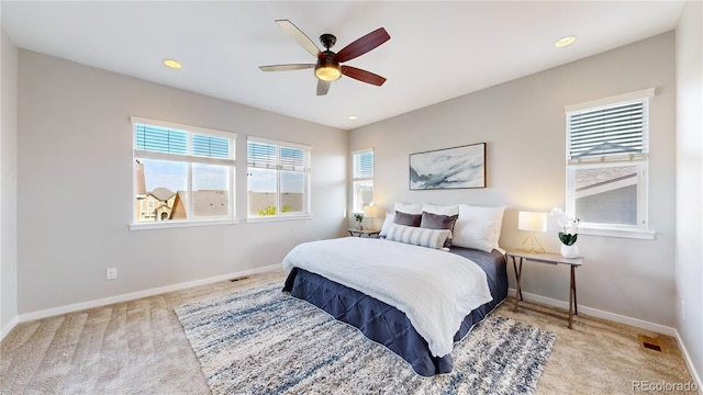 carpeted bedroom with ceiling fan