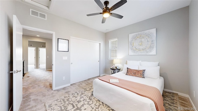 carpeted bedroom with ceiling fan