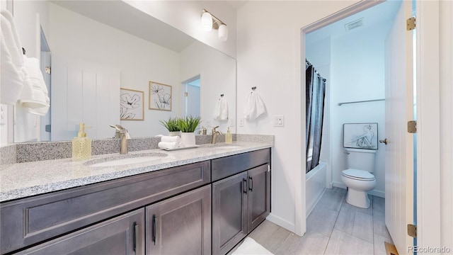 full bathroom with vanity, toilet, and shower / bath combination with curtain