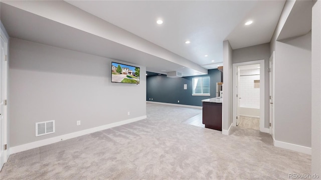 basement with light colored carpet