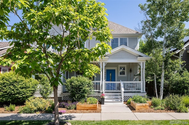 10069 E 28th Ave, Denver, CO 80238 - american foursquare style home with covered porch and a shingled roof