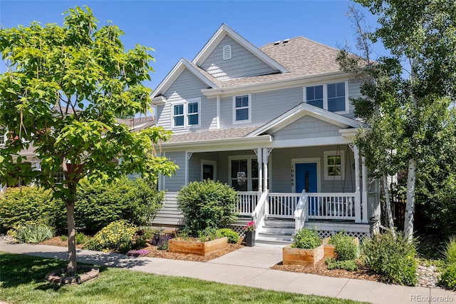 10069 E 28th Ave, Denver, CO 80238 - view of front of house with a porch and roof with shingles