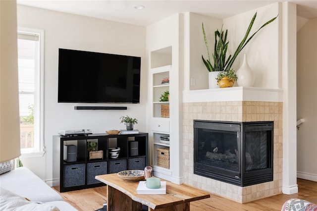 10069 E 28th Ave, Denver, CO 80238 - living room with wood finished floors and a tile fireplace