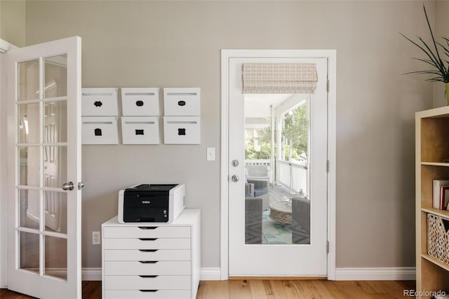 10069 E 28th Ave, Denver, CO 80238 - doorway featuring wood finished floors and baseboards