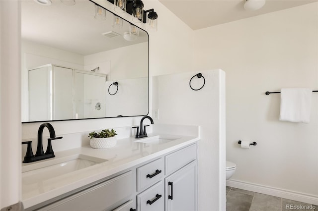 10069 E 28th Ave, Denver, CO 80238 - full bathroom with double vanity, a shower with door, and tile patterned floors