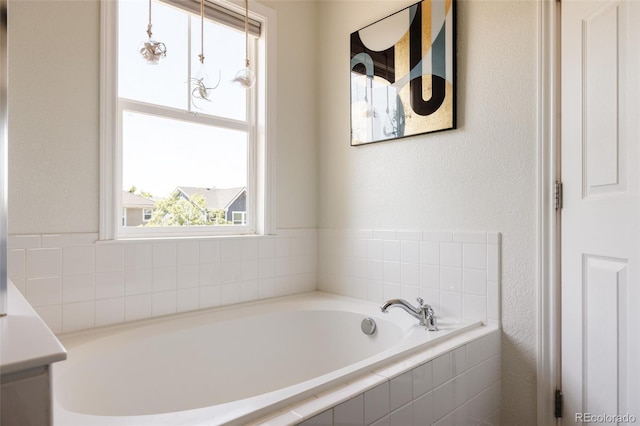 10069 E 28th Ave, Denver, CO 80238 - full bath with a garden tub, vanity, and a textured wall