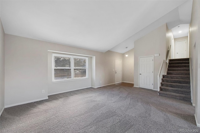 interior space featuring carpet floors, high vaulted ceiling, baseboards, and stairway