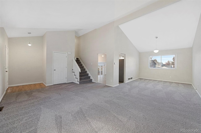 unfurnished living room with high vaulted ceiling, light carpet, visible vents, baseboards, and stairs