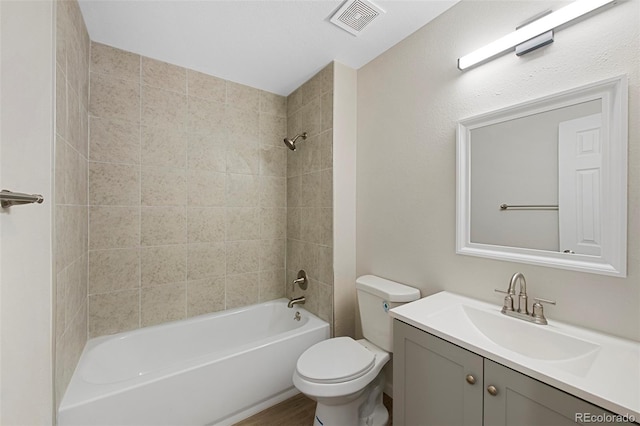 full bath with toilet, shower / bathtub combination, vanity, and visible vents