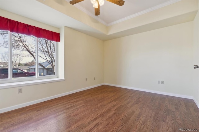 spare room featuring crown molding, ceiling fan, and wood-type flooring