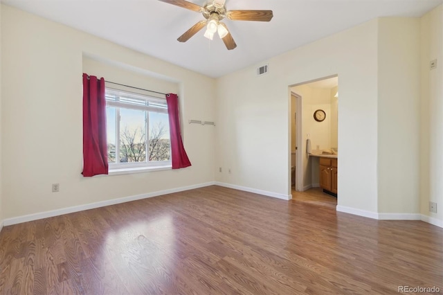 empty room featuring ceiling fan and wood-type flooring