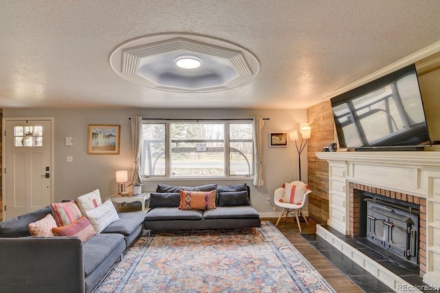 811 W Main St, Buena Vista, CO 81211 - living area with a textured ceiling, dark wood-type flooring, baseboards, and a healthy amount of sunlight