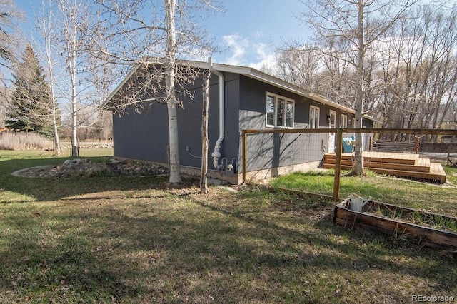 811 W Main St, Buena Vista, CO 81211 - view of side of property featuring a wooden deck and a lawn