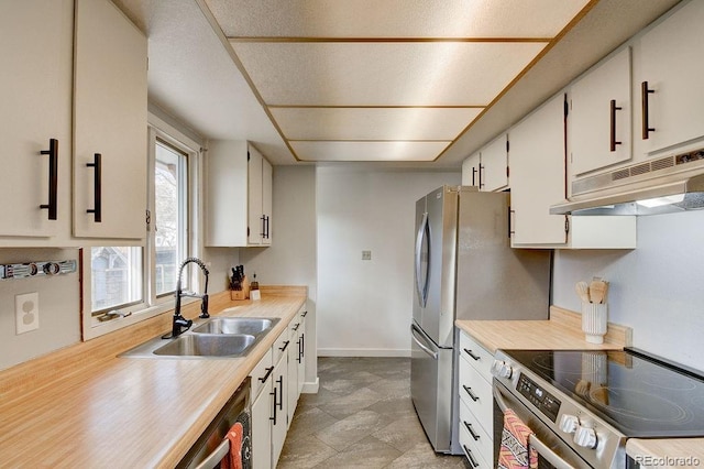 811 W Main St, Buena Vista, CO 81211 - kitchen featuring a sink, electric range, under cabinet range hood, light countertops, and white cabinets