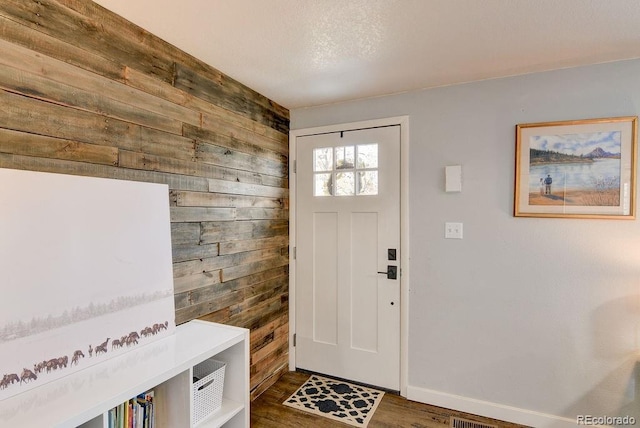 811 W Main St, Buena Vista, CO 81211 - entrance foyer with baseboards, wooden walls, and wood finished floors