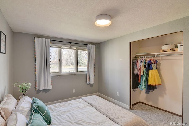 811 W Main St, Buena Vista, CO 81211 - bedroom featuring a textured ceiling, carpet flooring, a closet, and baseboards