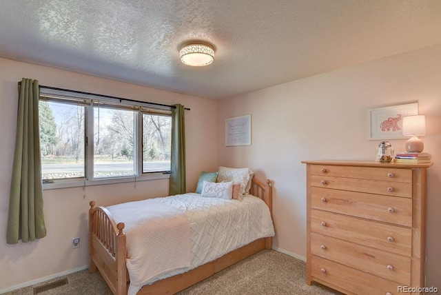 811 W Main St, Buena Vista, CO 81211 - bedroom featuring a textured ceiling, visible vents, baseboards, and carpet floors
