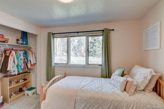 811 W Main St, Buena Vista, CO 81211 - bedroom featuring a textured ceiling, carpet flooring, and a closet