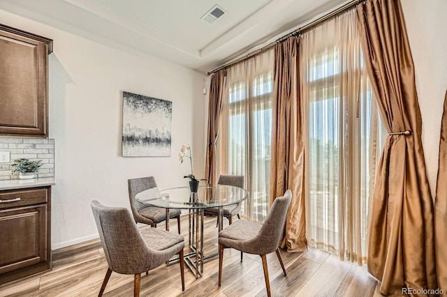 21701 E 50th Dr, Aurora, CO 80019 - dining area featuring light wood-style floors and baseboards