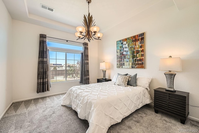 21701 E 50th Dr, Aurora, CO 80019 - bedroom with a chandelier, carpet floors, and baseboards