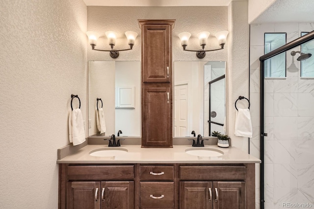 21701 E 50th Dr, Aurora, CO 80019 - full bathroom with a textured wall, a stall shower, and double vanity
