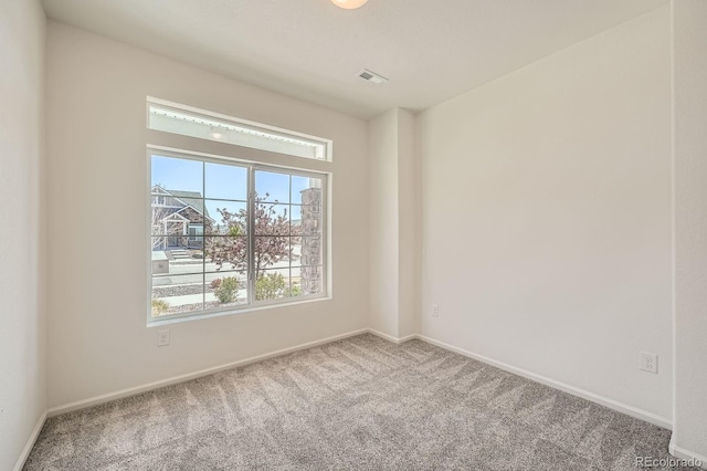 21701 E 50th Dr, Aurora, CO 80019 - carpeted spare room featuring baseboards