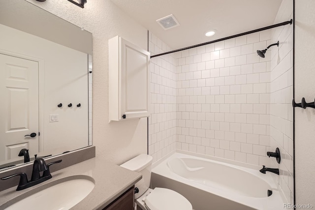 21701 E 50th Dr, Aurora, CO 80019 - full bathroom featuring vanity, toilet, washtub / shower combination, and recessed lighting