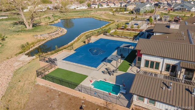 21701 E 50th Dr, Aurora, CO 80019 - aerial view of residential area with a pool area and a nearby body of water