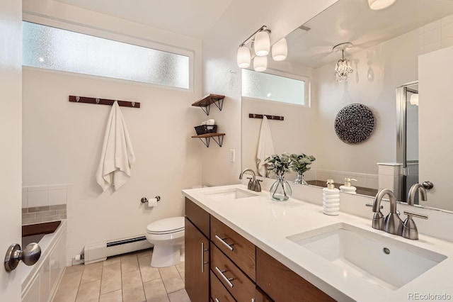 full bathroom featuring double vanity, a baseboard radiator, a sink, and toilet