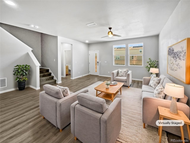 living room featuring ceiling fan and wood-type flooring