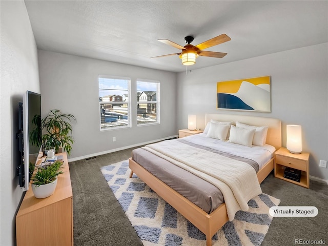 carpeted bedroom featuring ceiling fan