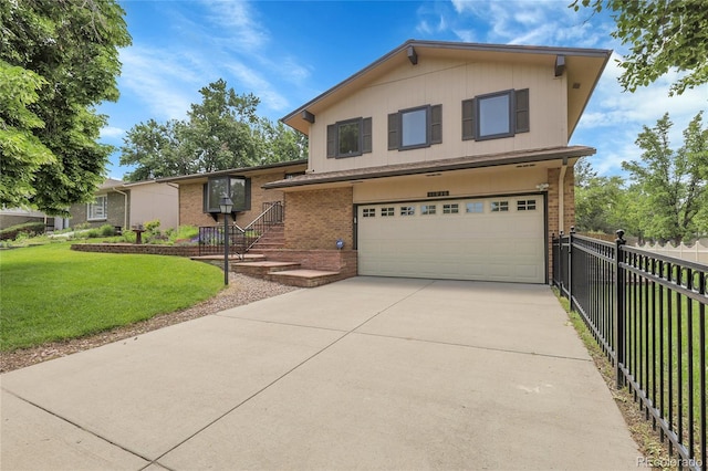 11936 E Oregon Cir, Aurora, CO 80012 - split level home featuring brick siding, a garage, and concrete driveway