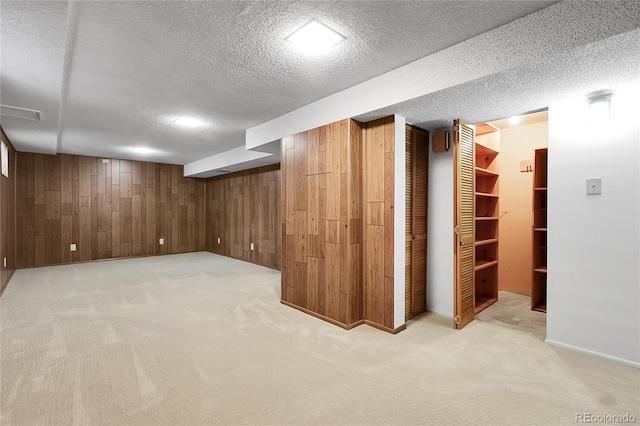 11936 E Oregon Cir, Aurora, CO 80012 - finished below grade area with wood walls, light carpet, and a textured ceiling