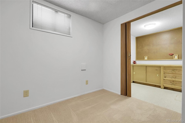 11936 E Oregon Cir, Aurora, CO 80012 - spare room with carpet flooring, a textured ceiling, and baseboards