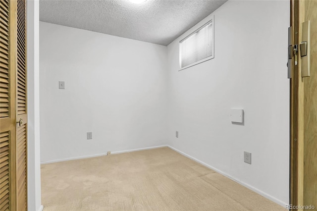 11936 E Oregon Cir, Aurora, CO 80012 - unfurnished bedroom featuring a textured ceiling, light colored carpet, a heating unit, and baseboards