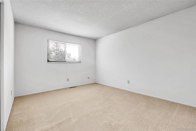 11936 E Oregon Cir, Aurora, CO 80012 - unfurnished room featuring light carpet and a textured ceiling
