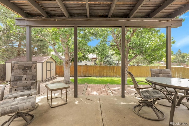 11936 E Oregon Cir, Aurora, CO 80012 - fenced backyard featuring a patio area and outdoor dining space