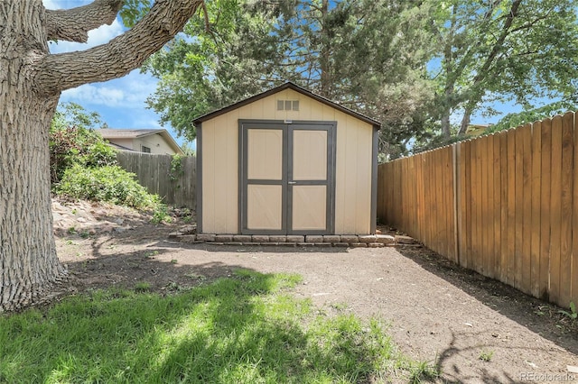 11936 E Oregon Cir, Aurora, CO 80012 - view of shed featuring a fenced backyard