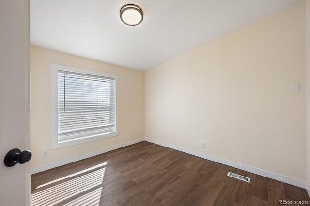 63560 Huckleberry Rd, Fowler, CO 81039 - spare room featuring dark wood-style floors and baseboards