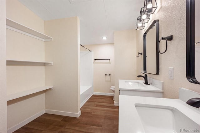 63560 Huckleberry Rd, Fowler, CO 81039 - bathroom with wood finished floors, toilet, baseboards, bathing tub / shower combination, and recessed lighting