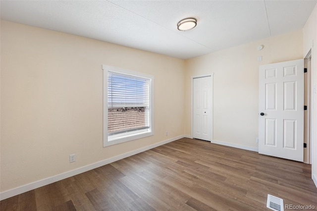 63560 Huckleberry Rd, Fowler, CO 81039 - unfurnished bedroom featuring wood finished floors, baseboards, and a closet