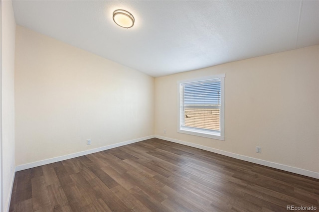 63560 Huckleberry Rd, Fowler, CO 81039 - spare room featuring dark wood-style flooring and baseboards