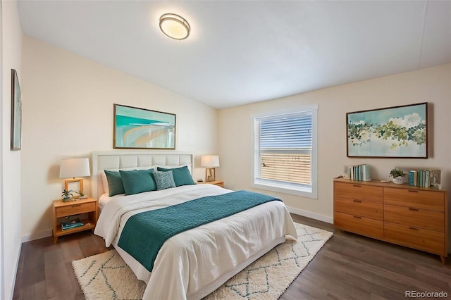 63560 Huckleberry Rd, Fowler, CO 81039 - bedroom featuring baseboards, dark wood finished floors, and vaulted ceiling