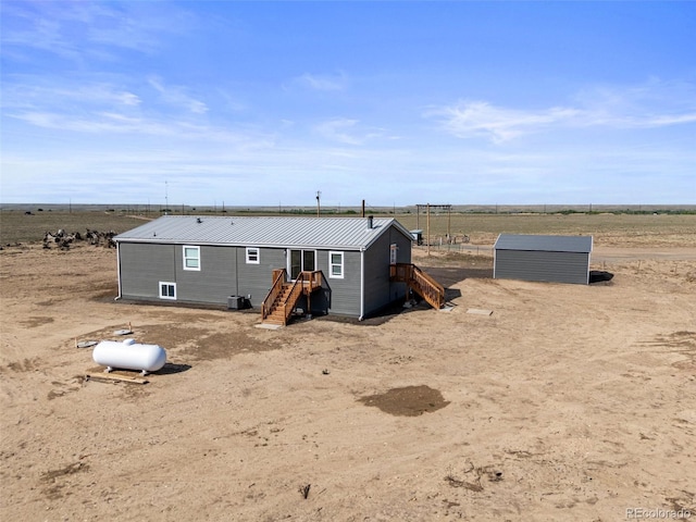 63560 Huckleberry Rd, Fowler, CO 81039 - back of house with metal roof and a view of countryside