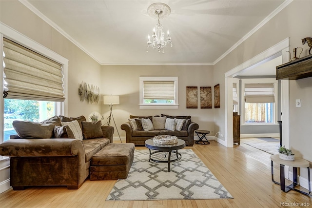 1510 S Cascade Ave, Colorado Springs, CO 80905 - living room featuring light wood-type flooring, healthy amount of natural light, a chandelier, and crown molding