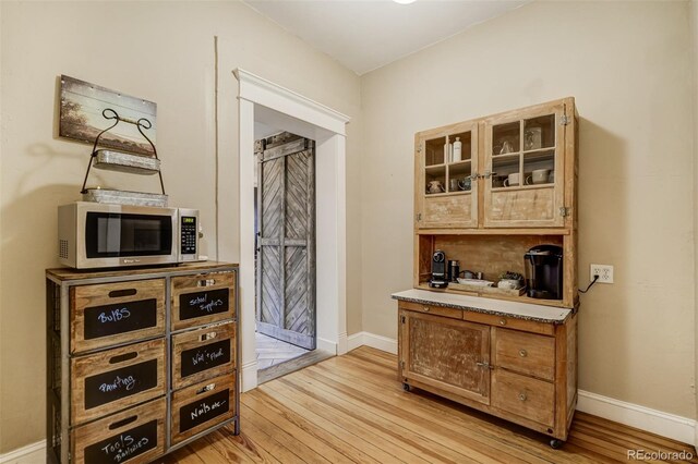 1510 S Cascade Ave, Colorado Springs, CO 80905 - bar with stainless steel microwave and light wood-style flooring