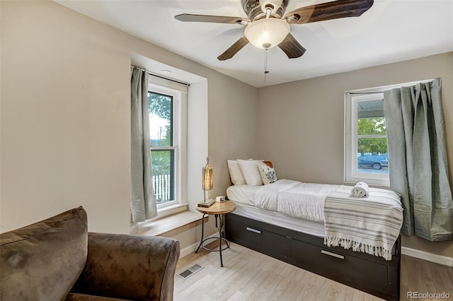 1510 S Cascade Ave, Colorado Springs, CO 80905 - bedroom with multiple windows, light wood finished floors, and ceiling fan